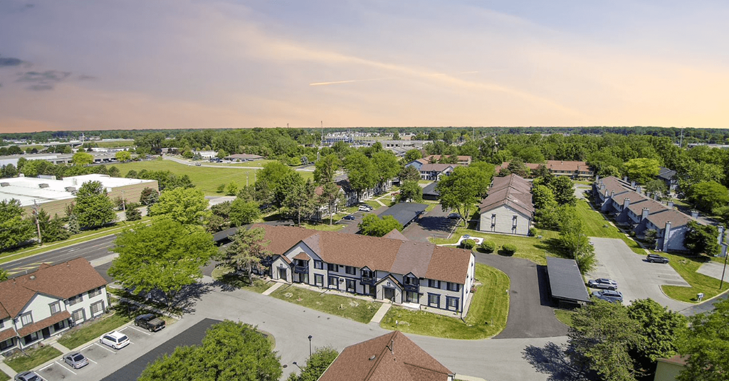 an aerial view of a neighborhood with houses and trees