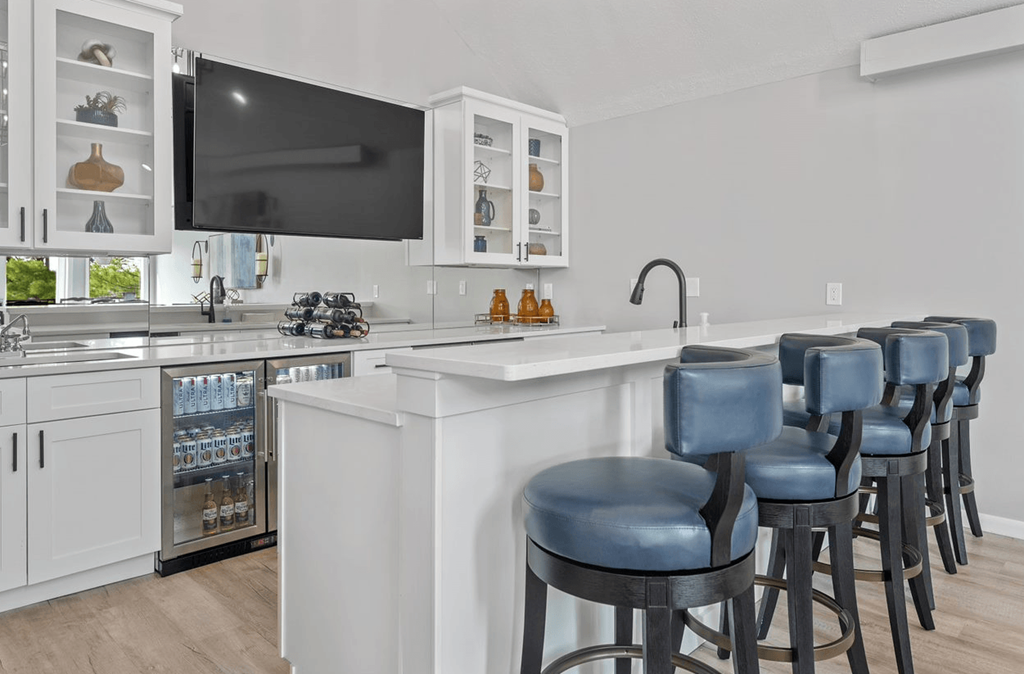 Kitchen with a breakfast bar and a flat screen tv at Normandy Club, Centerville, Ohio