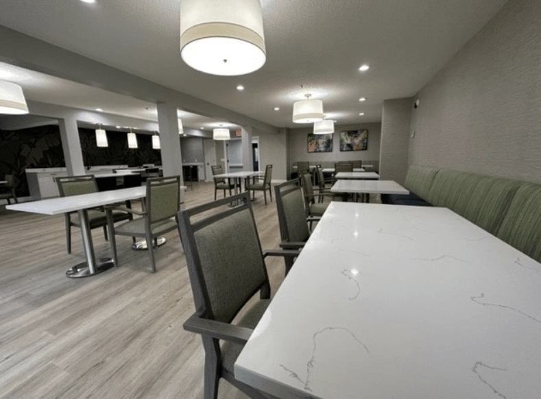 a large dining room with tables and chairs