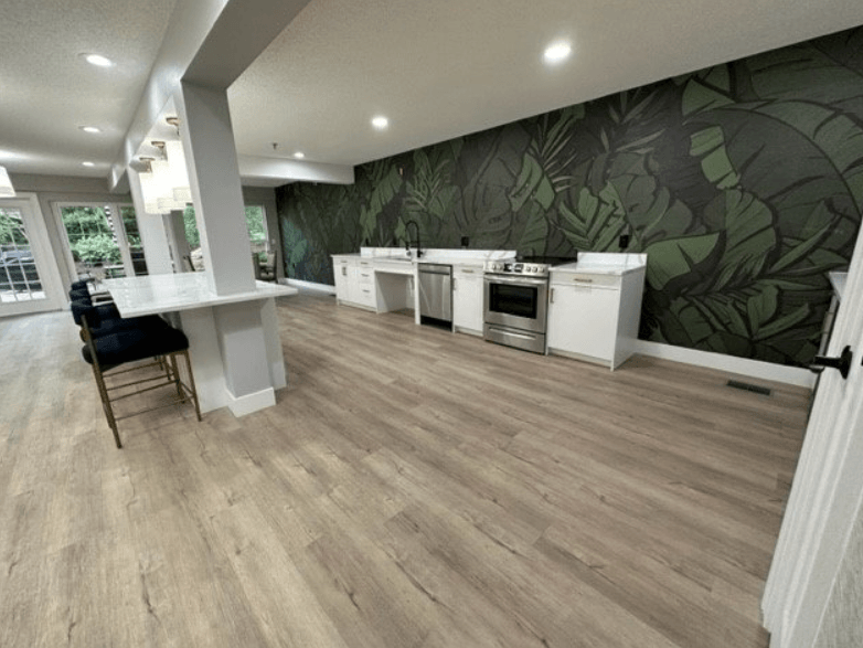 a large room with a kitchen and a dining area