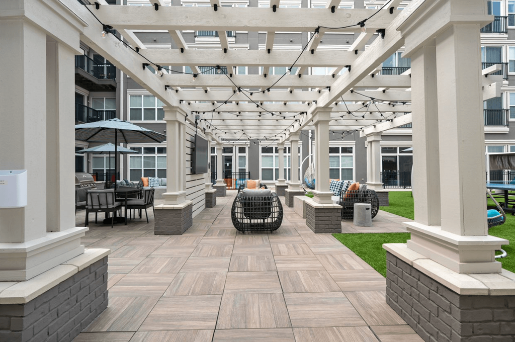 West Chester, OH Pet-Friendly Apartments - Liberty Center - Courtyard with Outdoor Furniture, Grilling Station, and Umbrella Tables