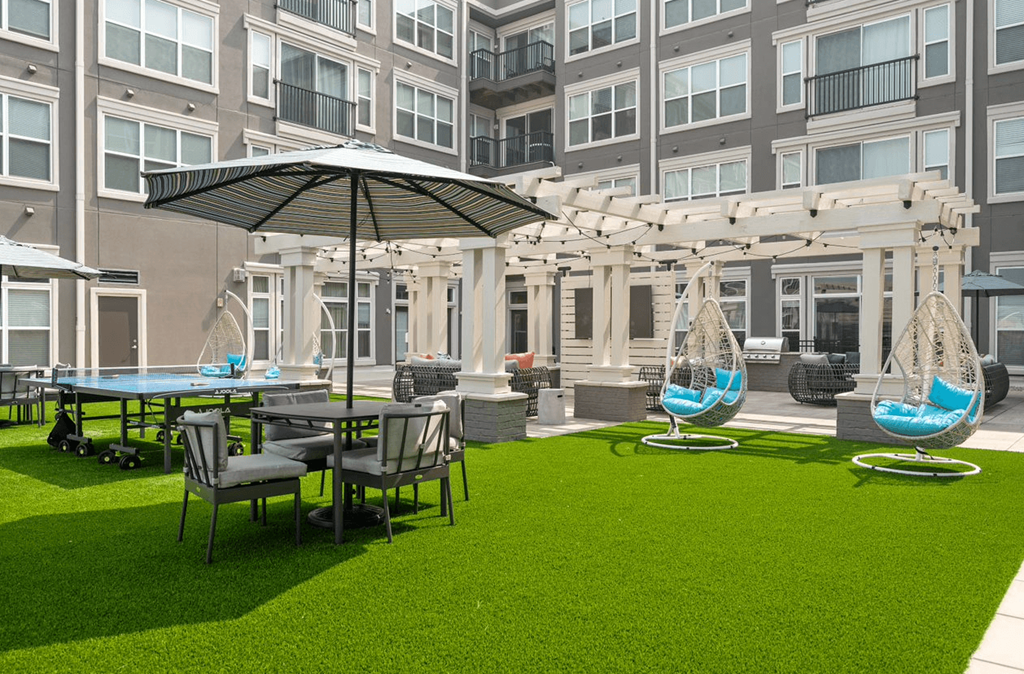 a courtyard with tables and chairs and umbrellas at the bradley braddock road