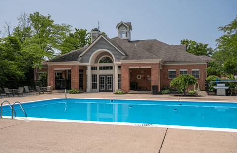 Swimming pool with a brick building in the background at Indian Lookout, West Carrollton, 45449