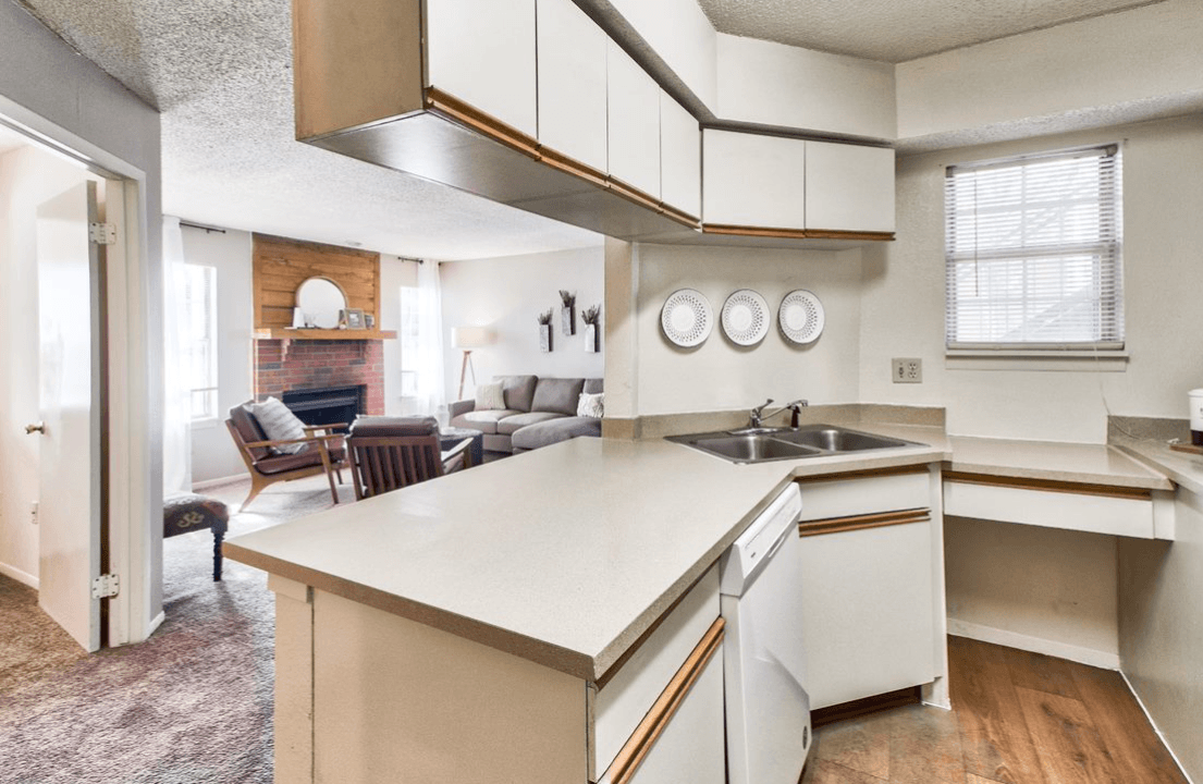 a kitchen with white cabinets and a white counter top at Spring Creek, Columbus