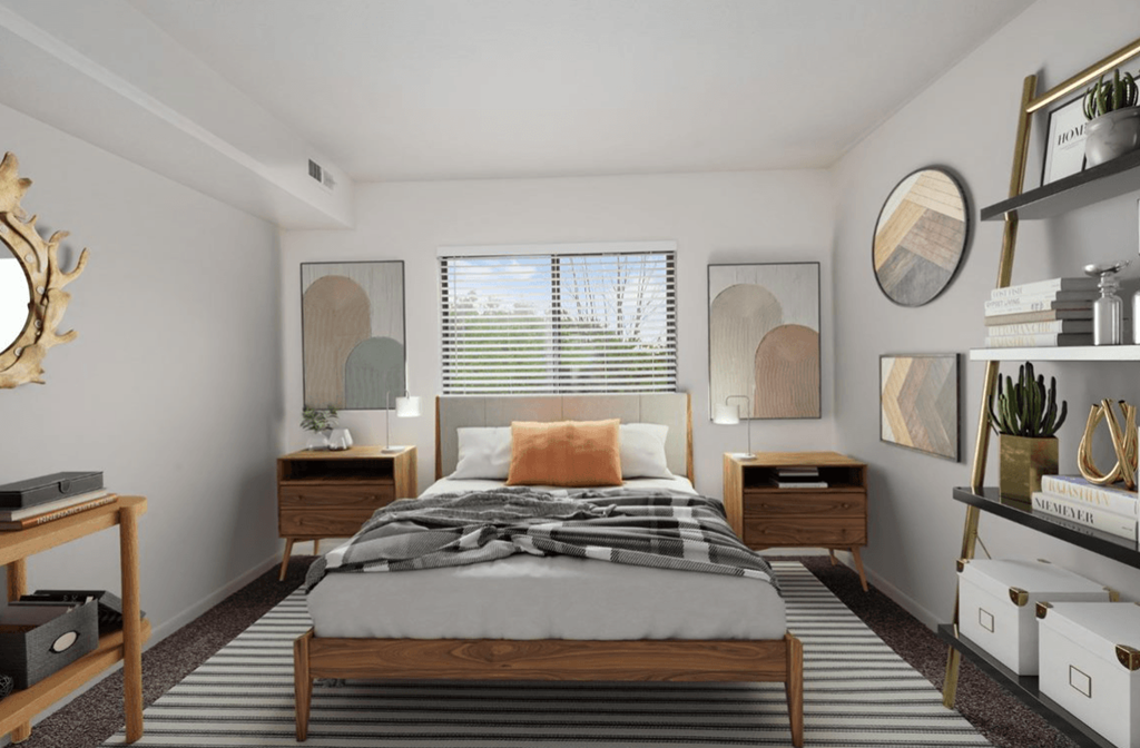 a bedroom with a bed and a window in a 555 waverly unit at The Woodridge Collection, Fairfield, OH 45014