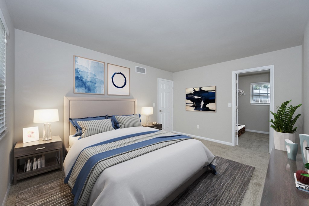 a bedroom with a large bed and a closet
