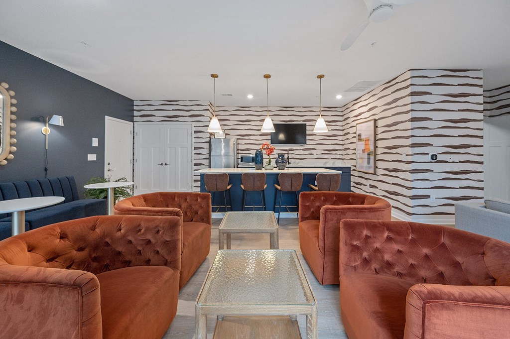 a living room with couches and chairs and a bar at Monmouth Row Apartments, Newport, 41071