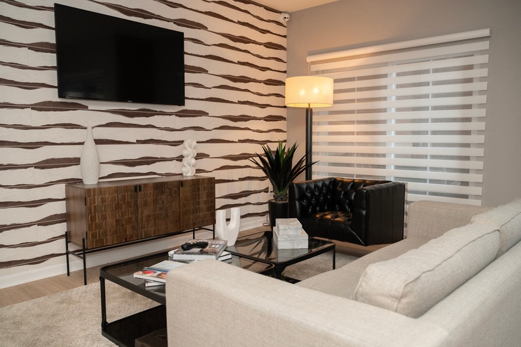 a living room with a couch and a coffee table at Monmouth Row Apartments, Newport, KY