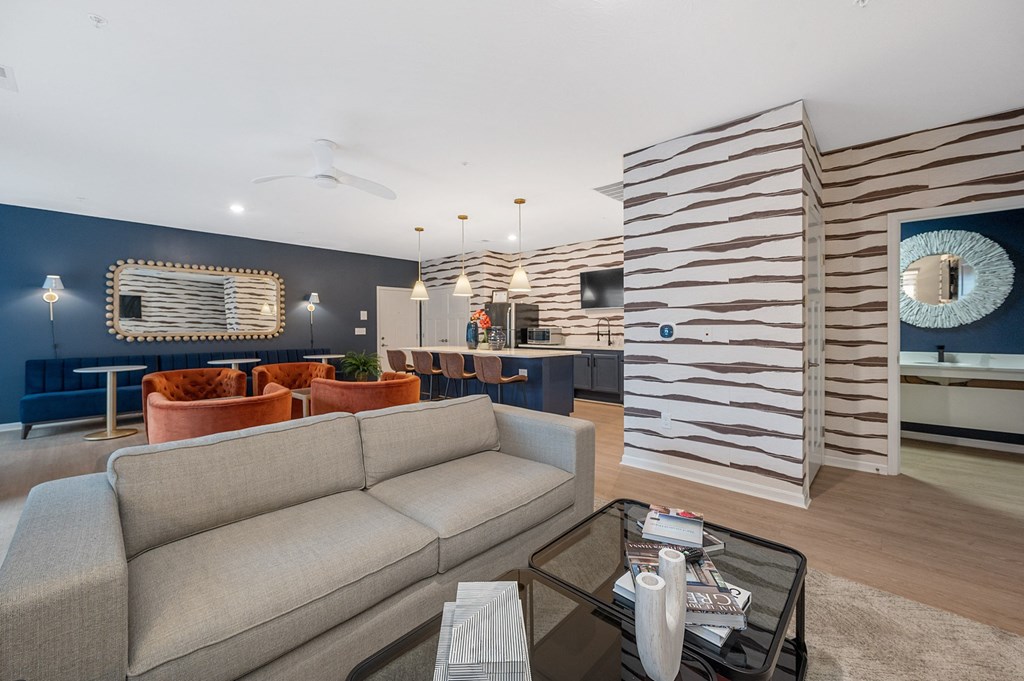 a living room with a couch and a coffee table at Monmouth Row Apartments, Newport, Kentucky