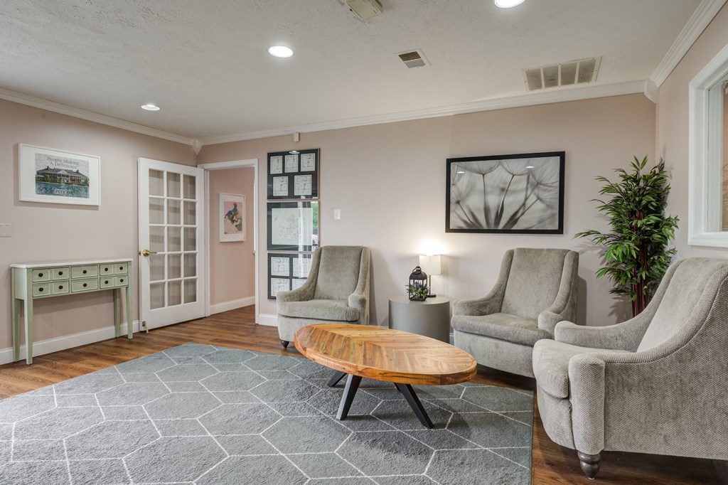 a living room with two chairs and a coffee table at Crystal Glen Apartments, Ohio