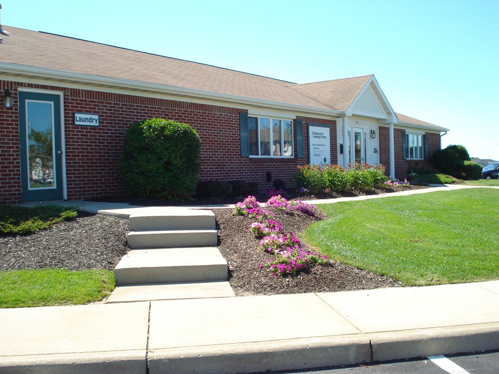 the front of a house with steps leading up to the front yard at Crystal Glen Apartments, Ohio, 45840