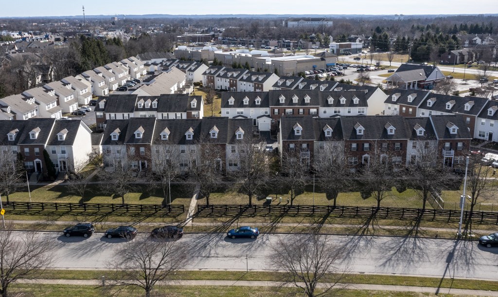 an aerial view of a neighborhood of houses with cars parked at Traditions at Slate Ridge, Reynoldsburg, 43068