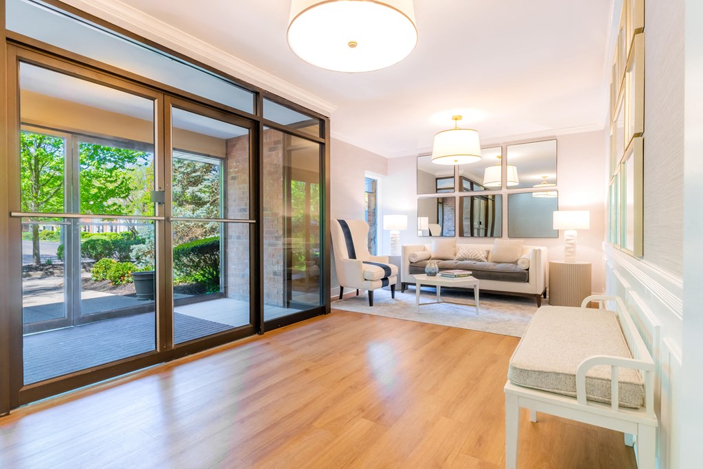 a living room with sliding glass doors to a patio at Indian Creek Apartments*, Ohio