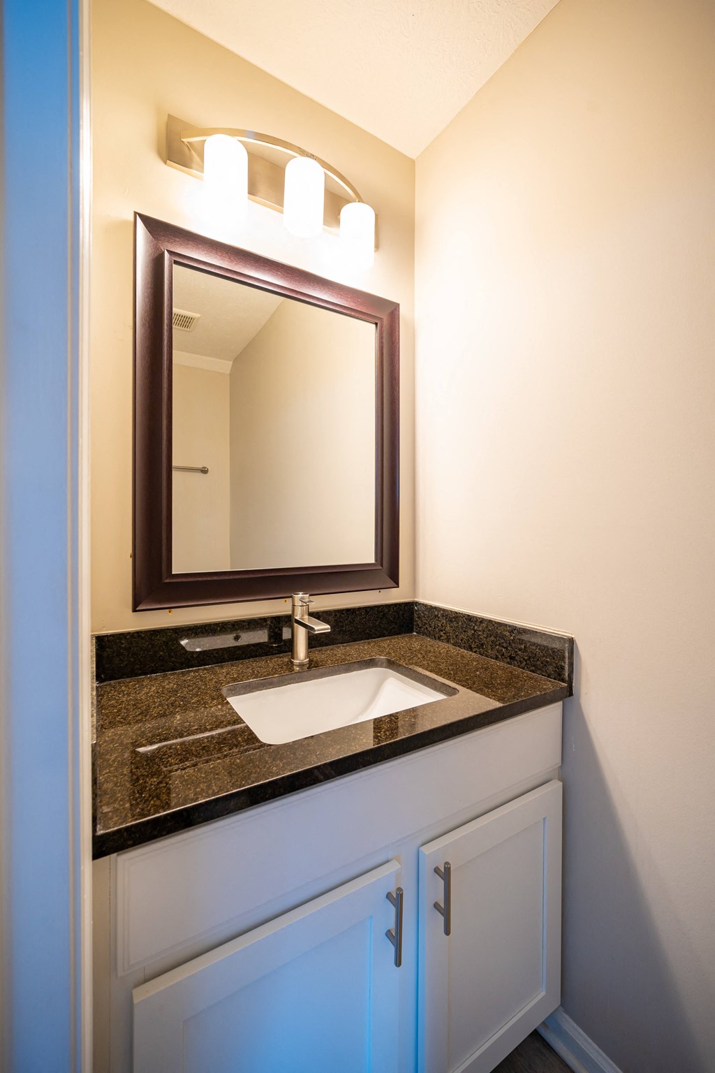 a bathroom with a sink and a mirror at Traditions at Slate Ridge, Ohio, 43068