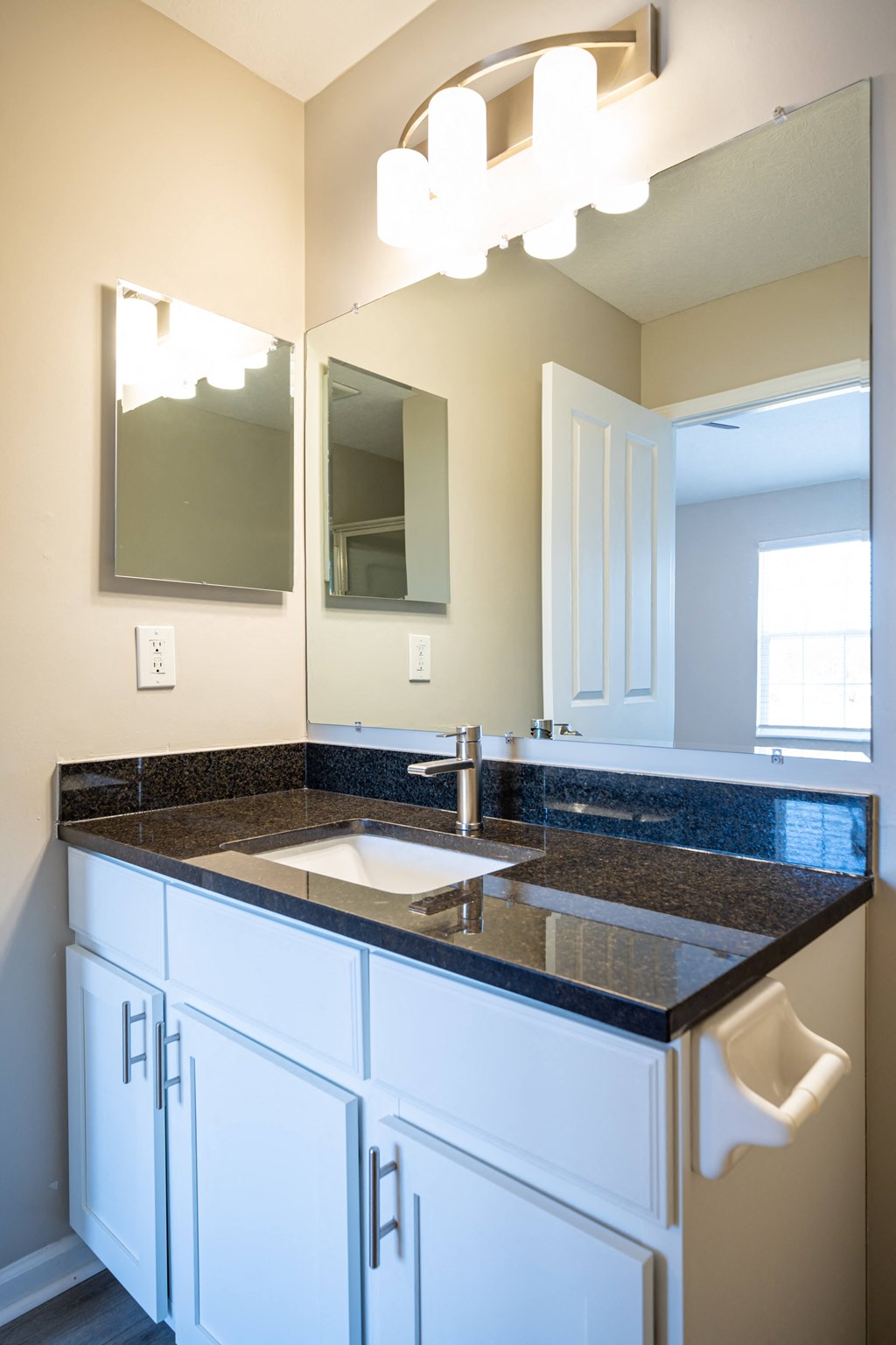 a bathroom with a sink and a mirror at Traditions at Slate Ridge, Reynoldsburg, OH