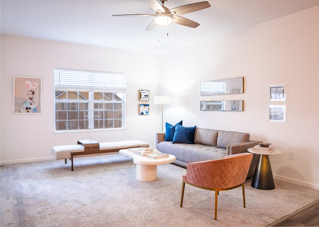 a living room with a couch coffee table and a ceiling fan  at Waterstone Landing, Perrysburg, OH, 43551