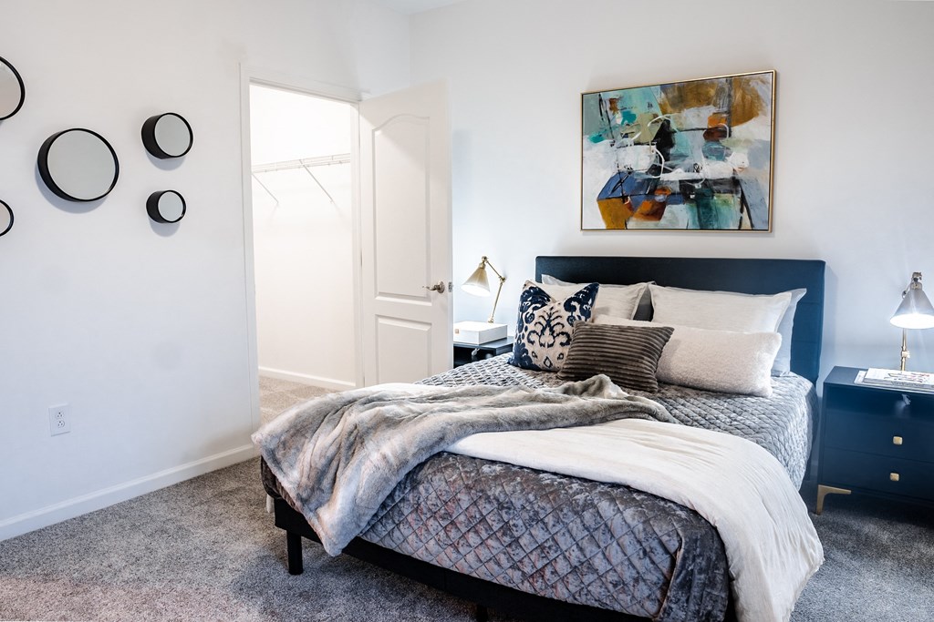 a bedroom with a bed and two nightstands  at Waterstone Landing, Perrysburg