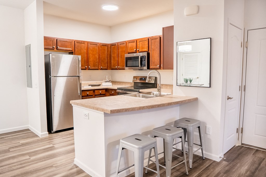 a kitchen with a large island and stainless steel appliances at Waterstone Landing, Ohio, 43551