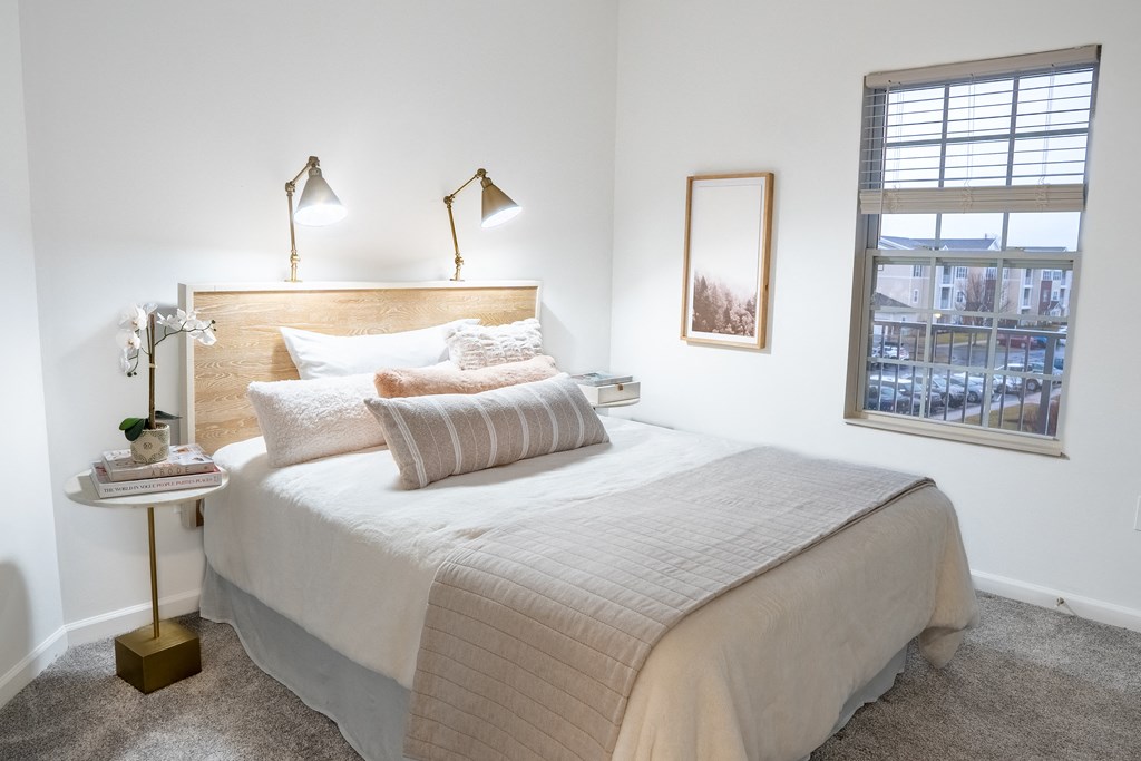 a bedroom with a bed and a window  at Waterstone Landing, Ohio