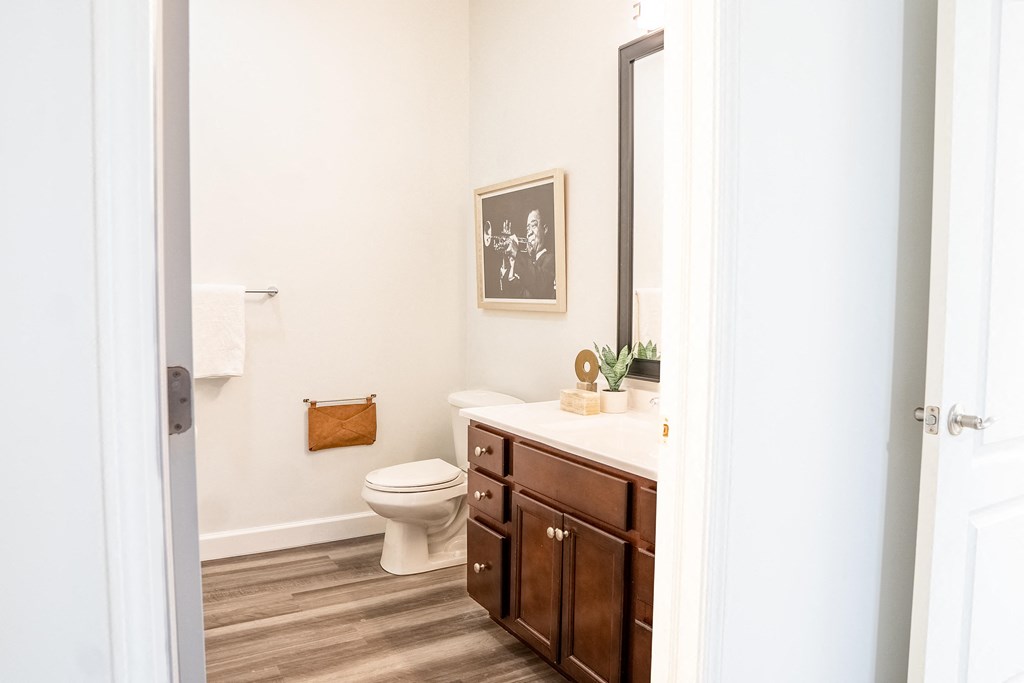 a bathroom with white walls and wood floors  at Waterstone Landing, Ohio, 43551