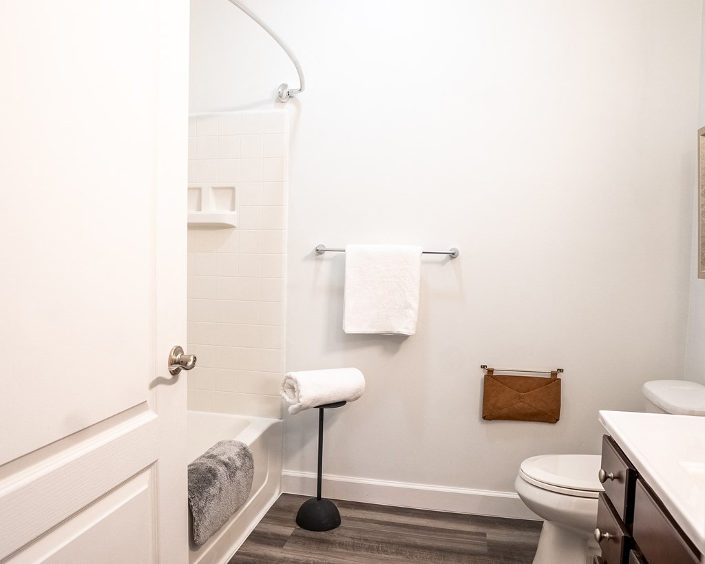 a bathroom with a toilet and a bathtub  at Waterstone Landing, Ohio