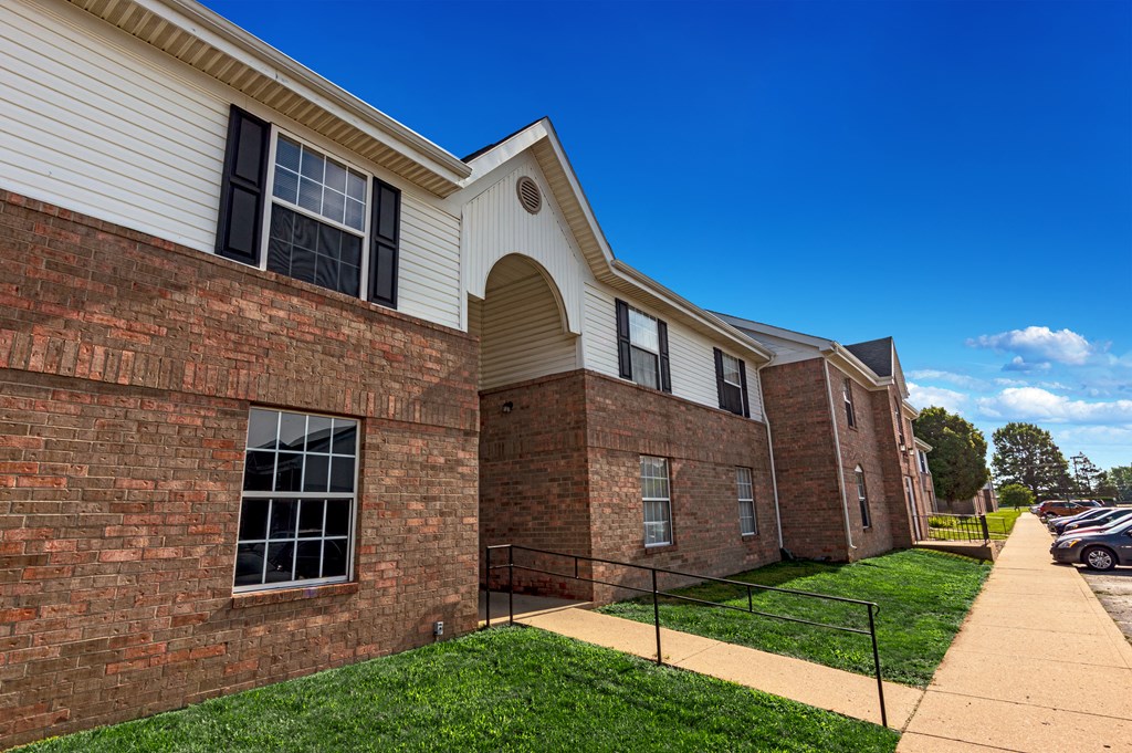 a brick building with a grassy area and a blue sky in the background at Parkview of Lebanon, Lebanon, 46052