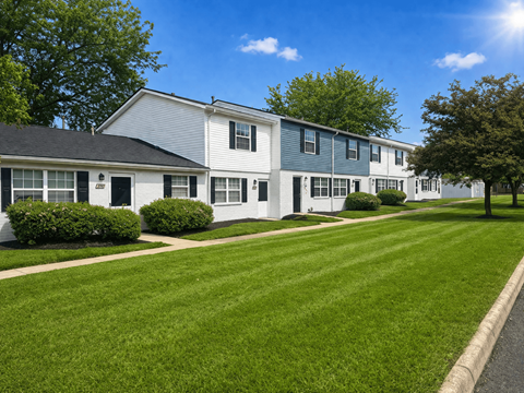 A row of houses with green lawns in front. at Indian Mound, Columbus, OH 43207