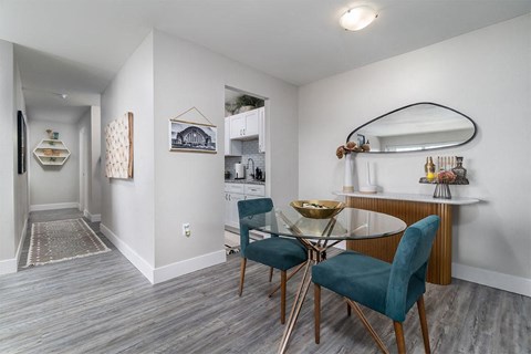a dining room with a glass table and chairs at The Heights Apartments, Ohio, 45220