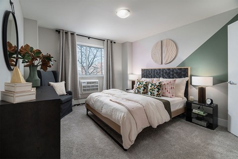 a bedroom with a bed and a window at The Heights Apartments, Cincinnati