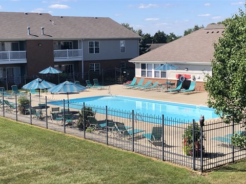 Outdoor pool area with sundeck and clubhouse at Fieldstone Apartments, Beavercreek, Ohio
