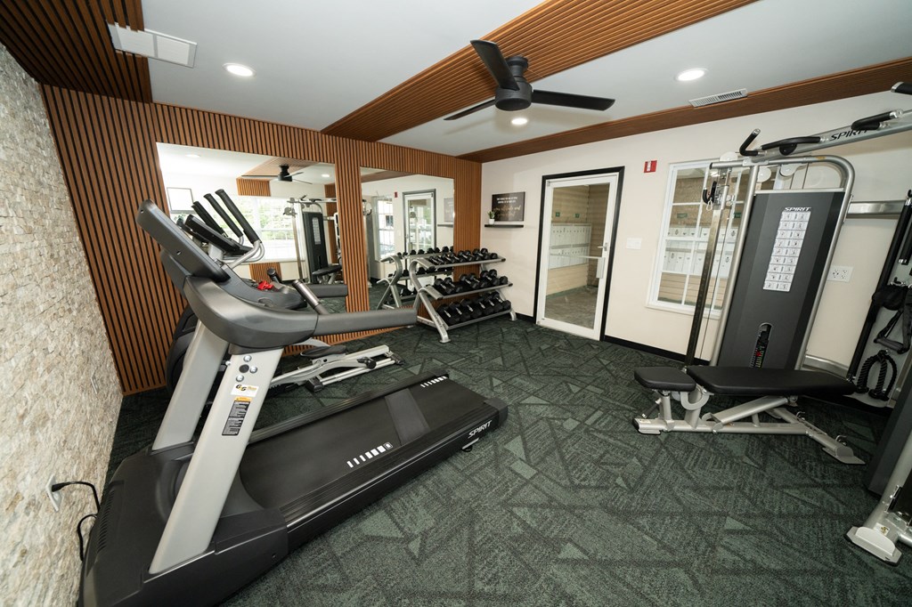 Gym with a treadmill and other exercise equipment at Honey Creek, IN, 46143