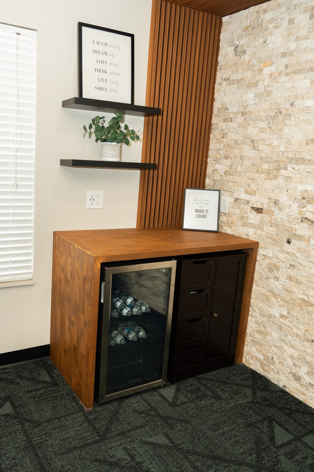 Room with a fireplace and a wooden cabinet with rocks in it at Honey Creek, 46143