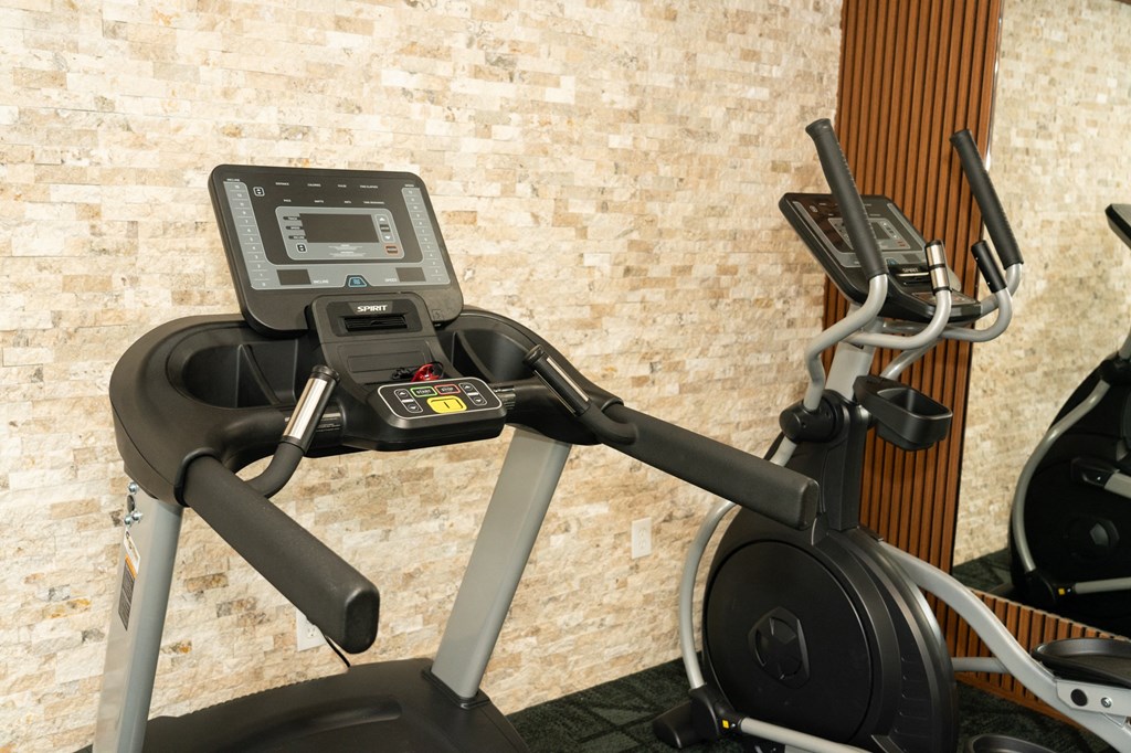 Treadmill with a monitor on the top of it at Honey Creek, Greenwood, IN