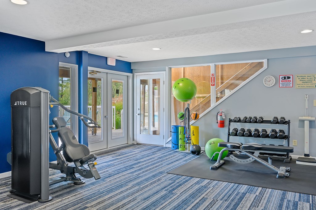 the gym at the enclave at woodbridge apartments in sugar land, tx