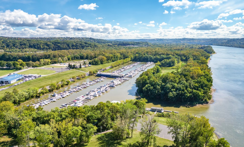 an aerial view of a boat marina next to a river