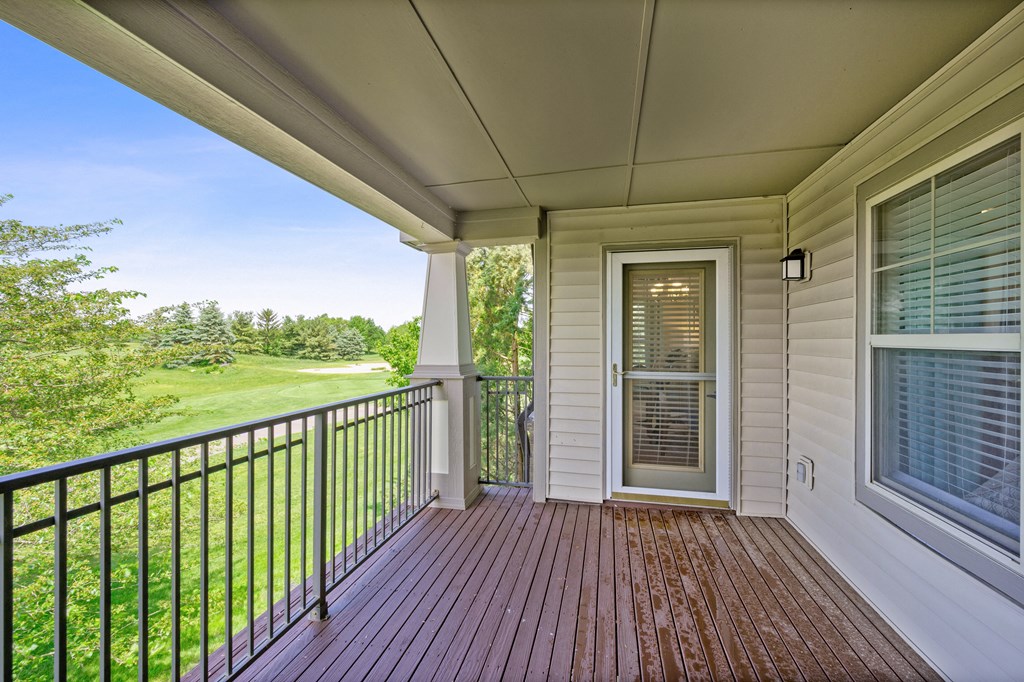 Front porch of a home with a door to the yard at Four Bridges, Liberty Township, Ohio