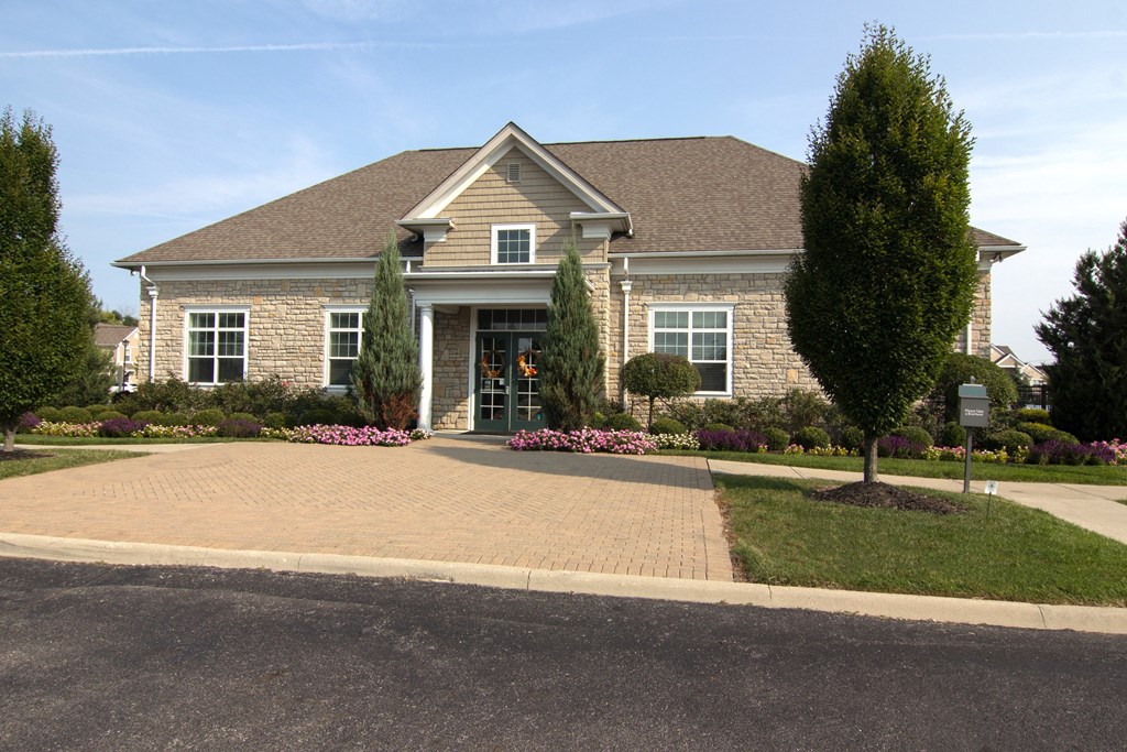 a house with a driveway and trees in front of it  at Grove City Summit, Ohio, 43123