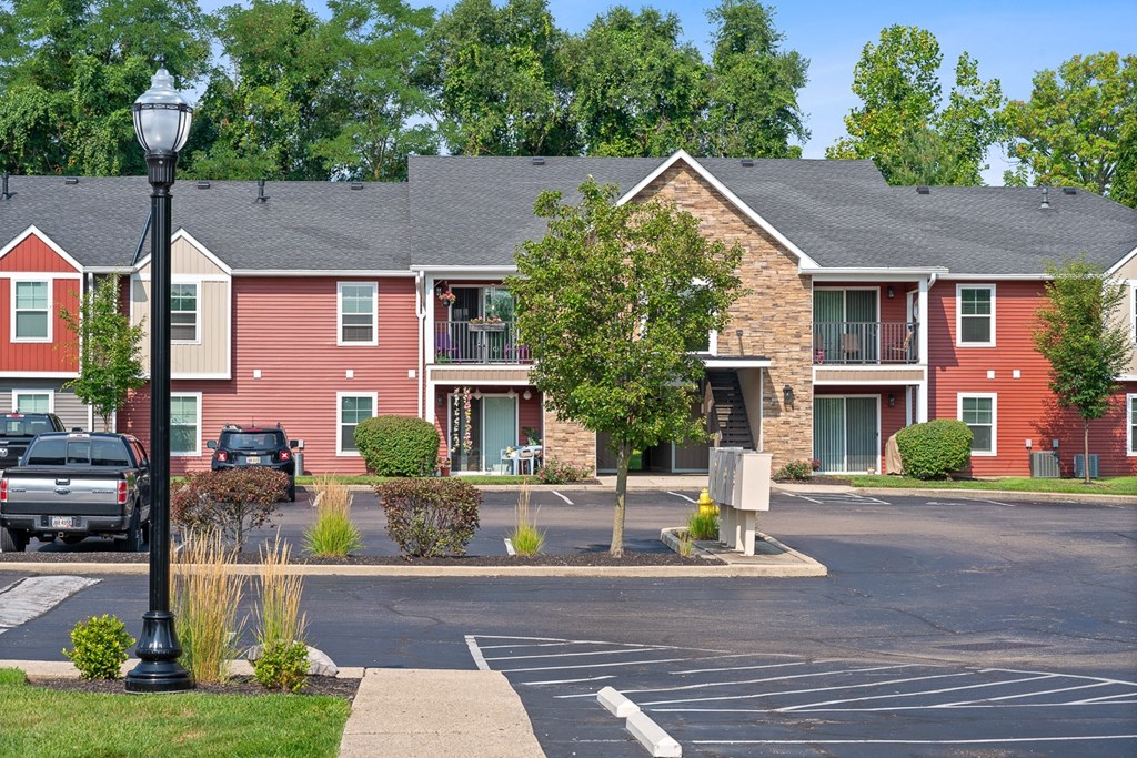 Street view of an apartment building with a parking lot at Galbraith Pointe Apartments and Townhomes, Ohio