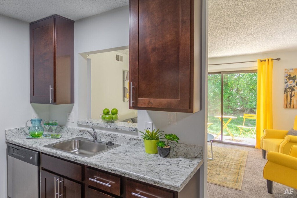 Kitchen with granite counter tops and a sink