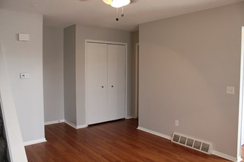 an empty room with a hardwood floor - Photo Gallery 29