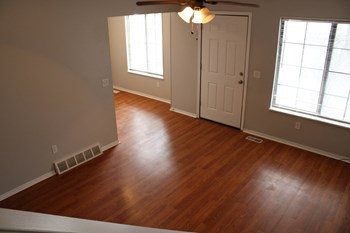 an image of a living room with hardwood floors and a ceiling fan - Photo Gallery 27