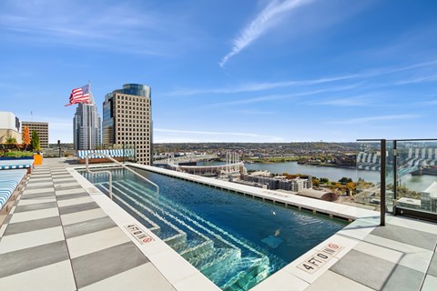 A swimming pool with a view of the city.