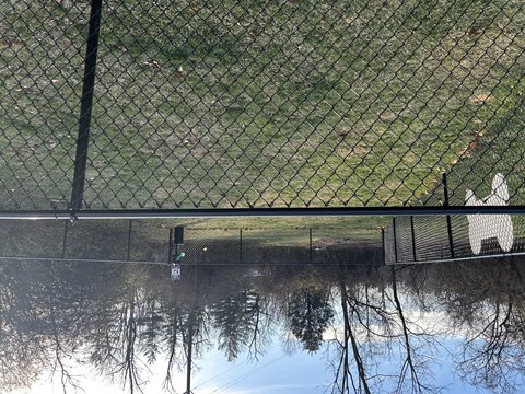 A black fence with a green grass field in the background  at The Apex, Ohio, 45239