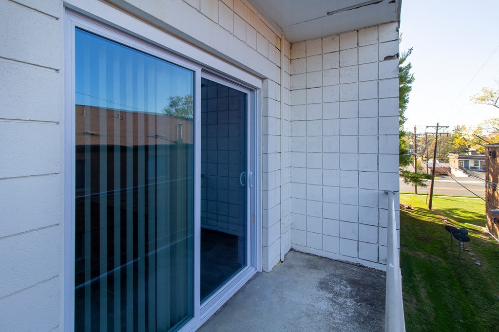 a sliding glass door on the side of a building
