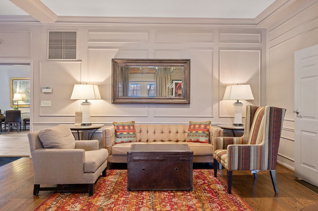 a living room with couches chairs and a table at Indian Creek Apartments*, Ohio