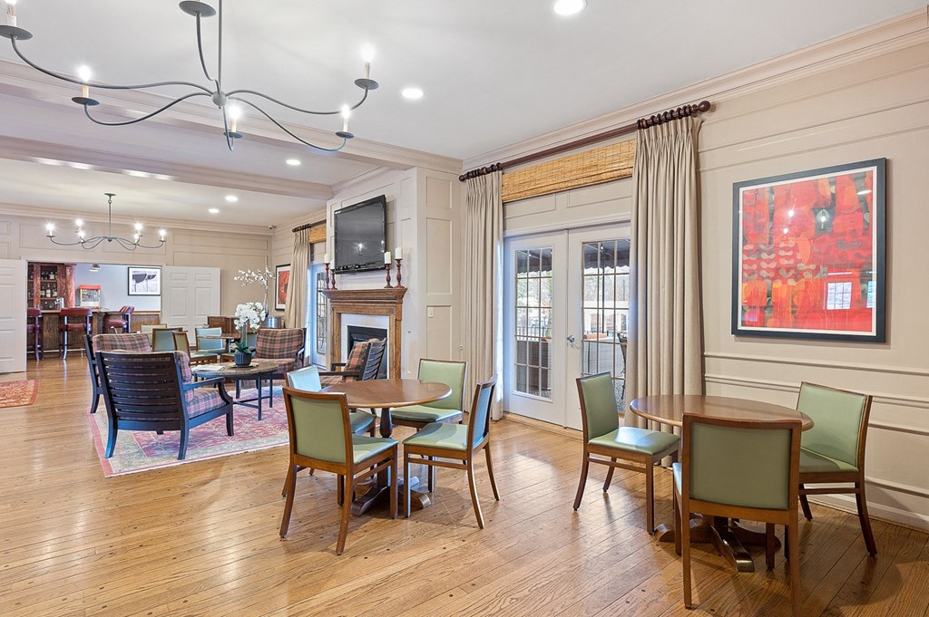a living room with tables and chairs and a fireplace at Indian Creek Apartments*, Ohio, 45236