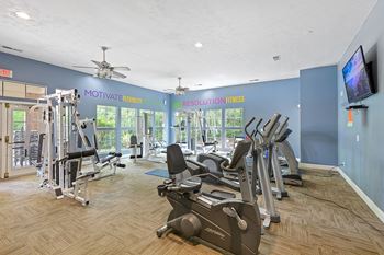 Gym with cardio equipment and a flat screen tv at Indian Lookout, West Carrollton