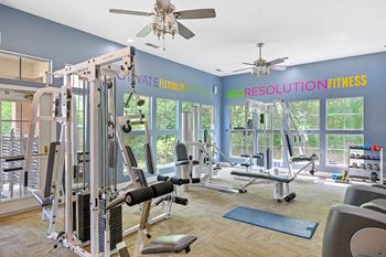 Gym with exercise equipment and windows with a view of the woods  at Indian Lookout, West Carrollton, OH