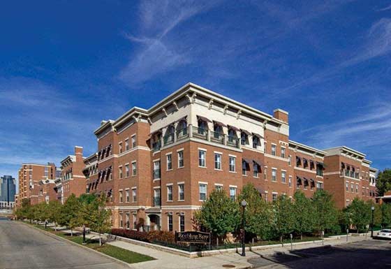 a large brick building on the side of a street
