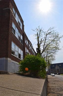a brick building on the side of a street
